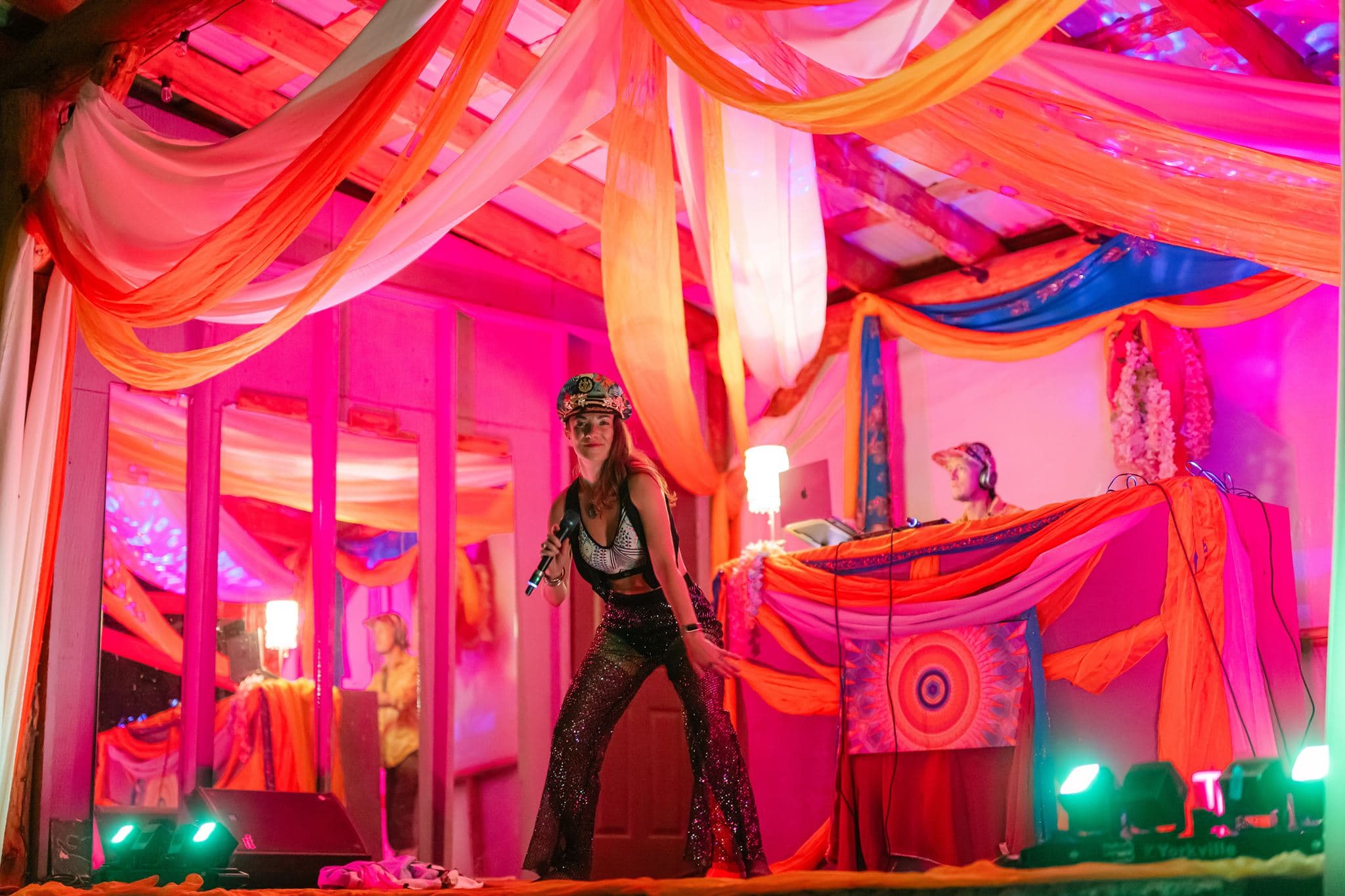 Lara Brightside commanding a colourful festival stage.